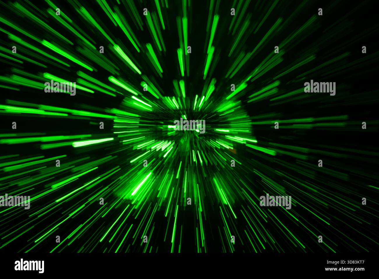 Green streaking light trails on black background Stock Photo