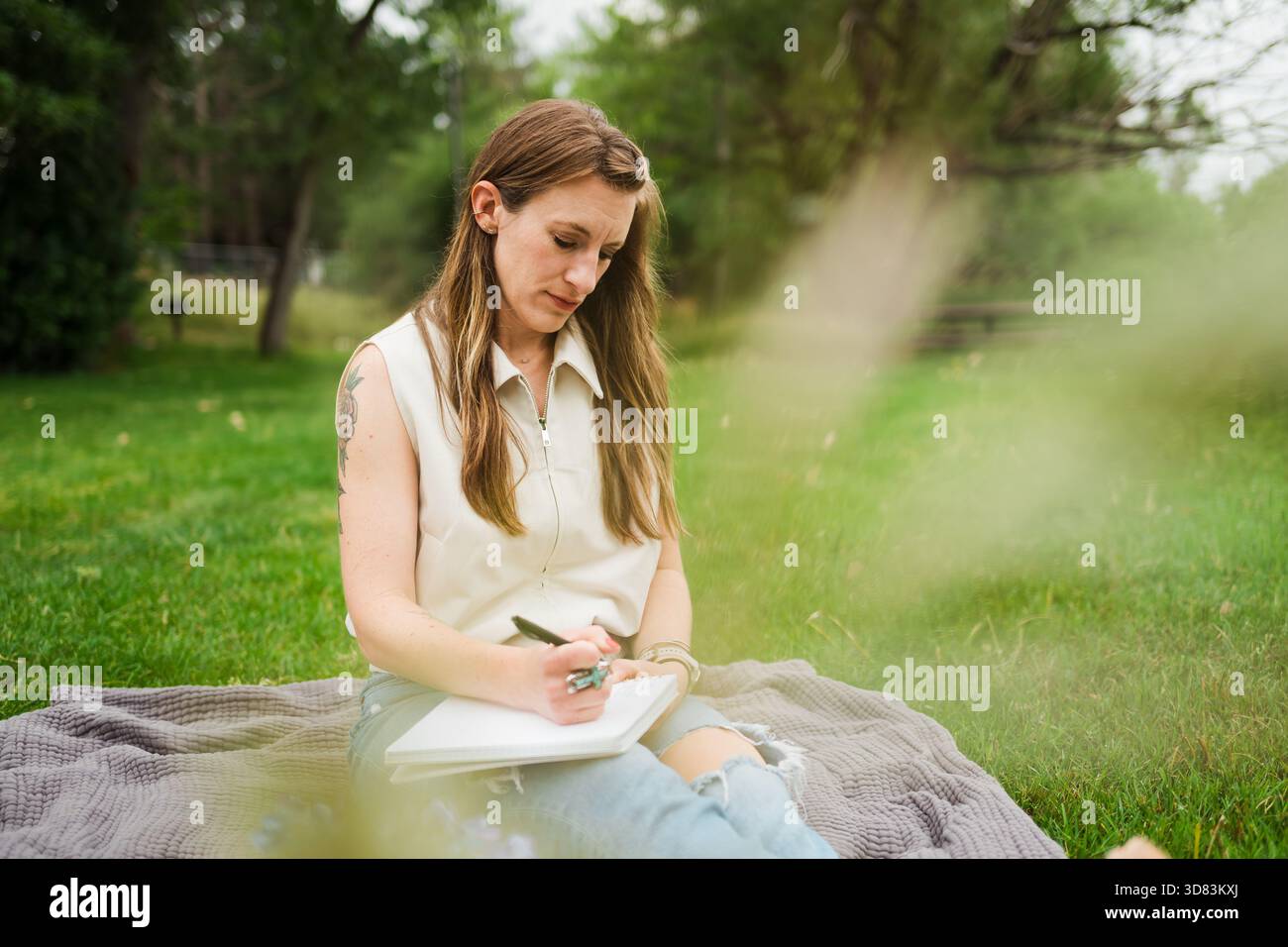 Woman outdoors in green park hi-res stock photography and images - Alamy