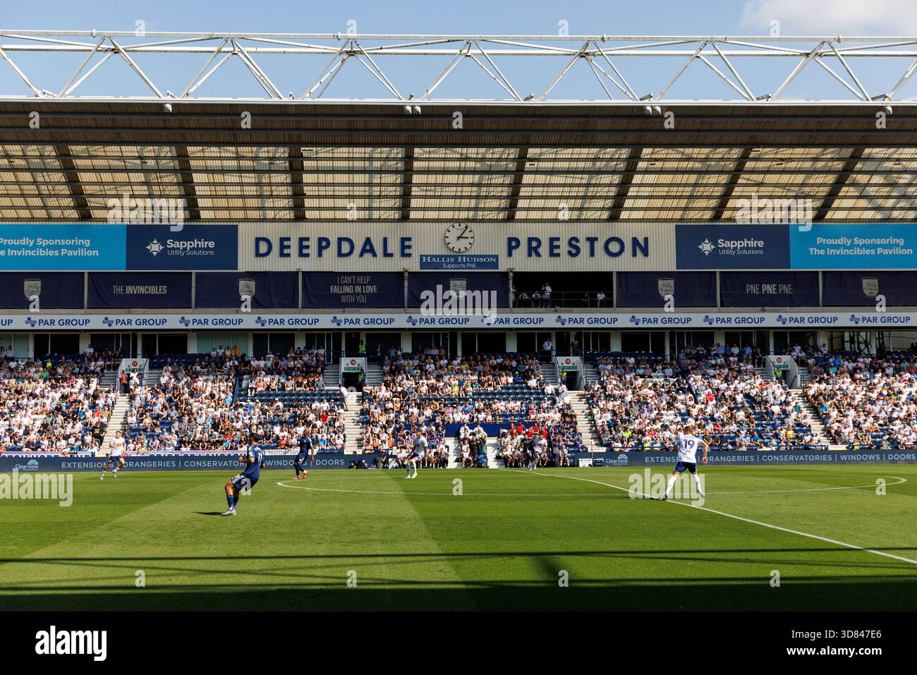 Preston, England - 16.08.2025: Players in action during a football match at Deepdale stadium, with spectators filling the stands beneath the roof stru Stock Photo
