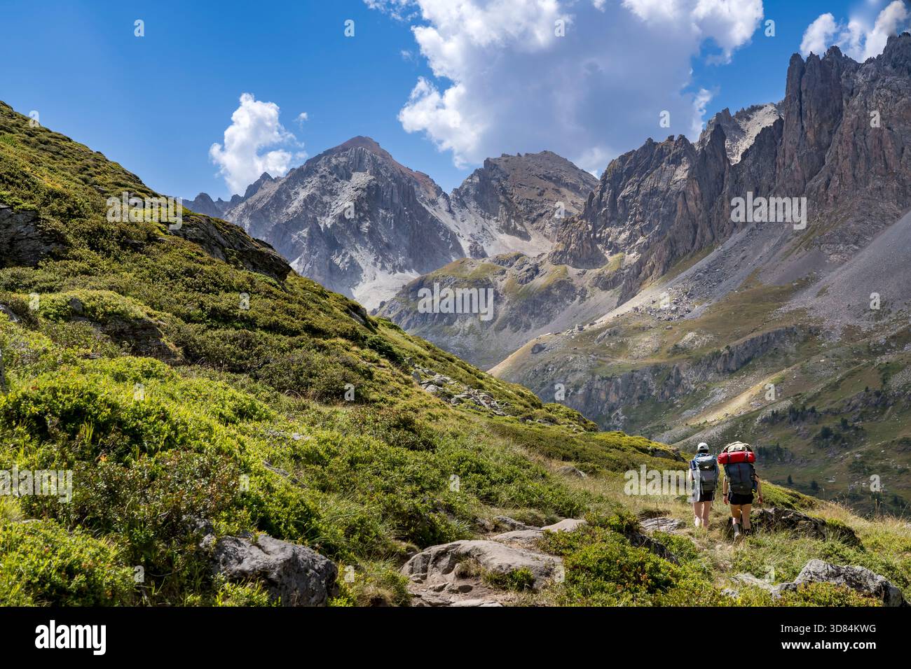 France, Hautes Alpes, Briancon region, Nevache, the upper Clarée valley, hikers in the upper Clarée valley, the Cerces massif in the background Stock Photo