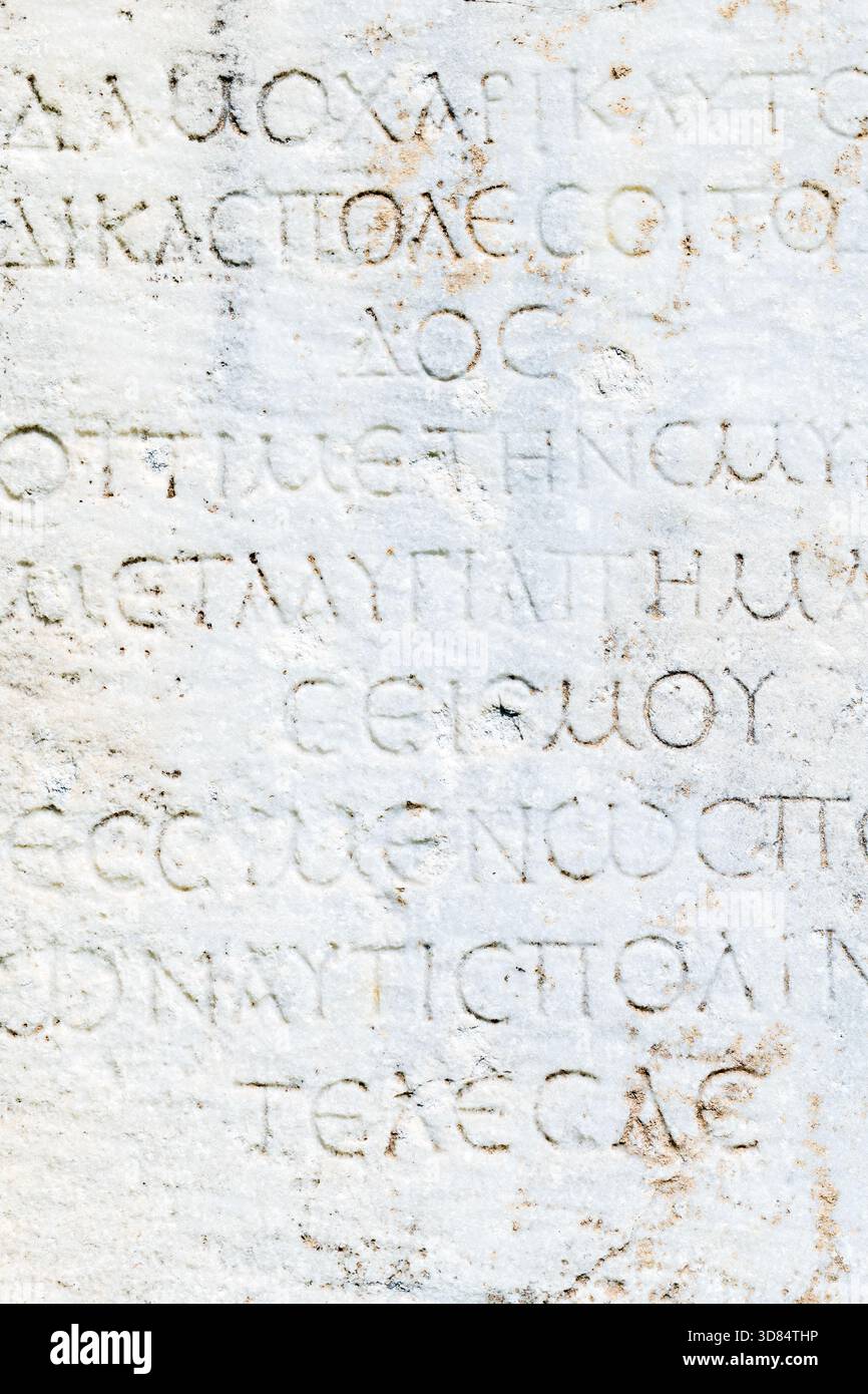 ancient marble, stone texture from ancient stone rock wall with european scripts Stock Photo