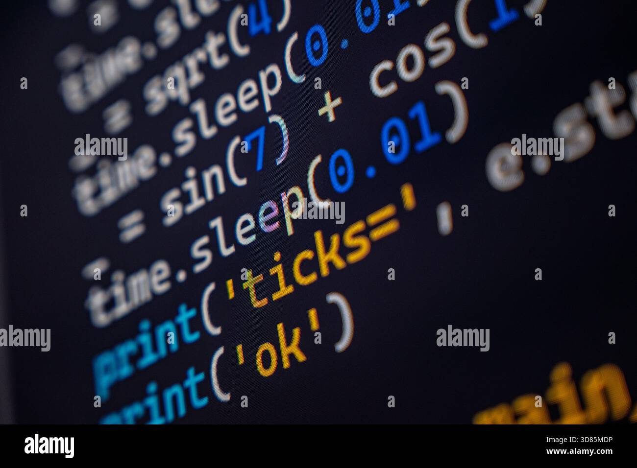 A detailed view of programming code displayed on a computer screen, showcasing syntax highlighting in various colors. Stock Photo