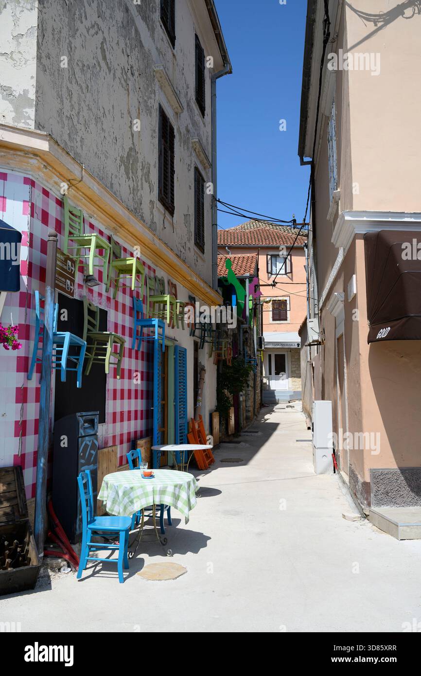 Café in a narrow street, Biograd, Croatia Stock Photo