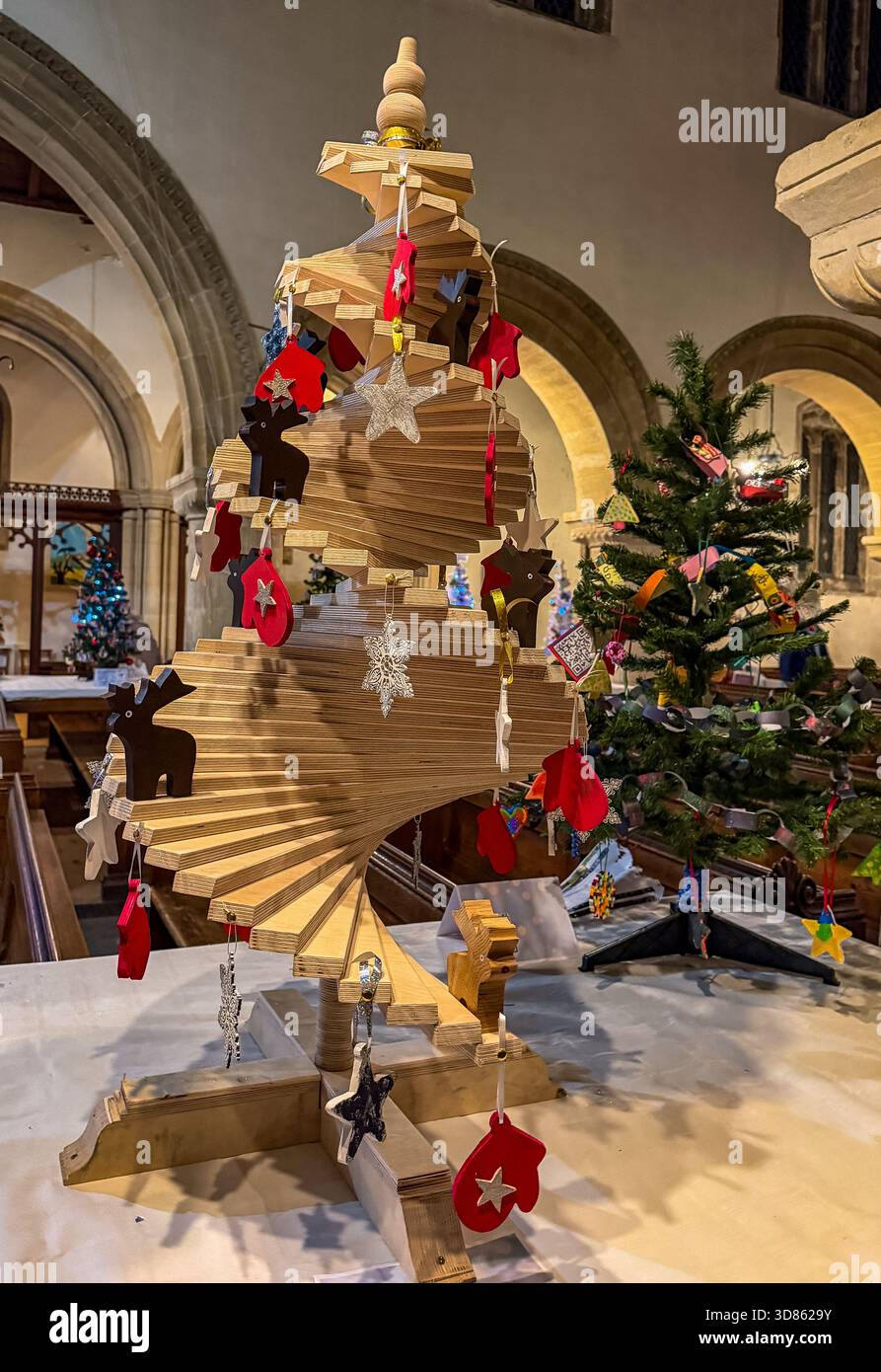 Wooden spiral Christmas tree decorated with hanging ornaments  St Mary's Church Calne Christmas tree festival - Smartphone Captured Stock Image