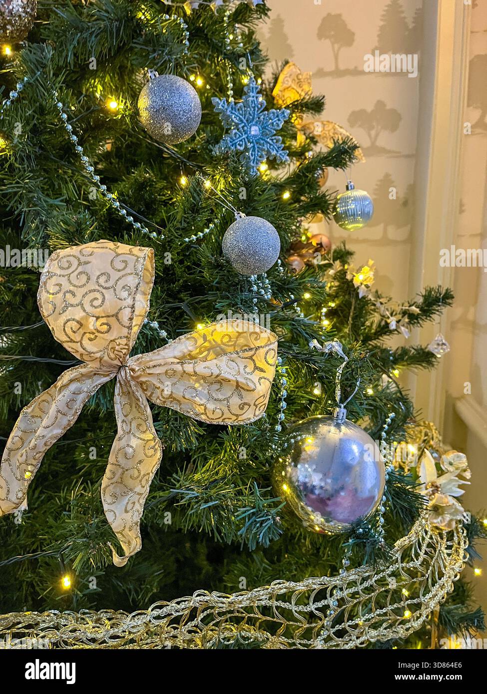 Artificial Christmas Tree Decorated in Elegant Silver and Gold Holiday Ornaments and baubles and beads - Smartphone Captured Stock Image