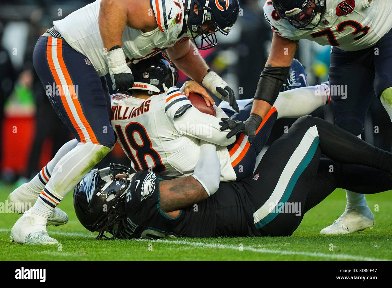 Philadelphia Eagles defensive tackle Jalen Carter (98), bottom, sacks ...