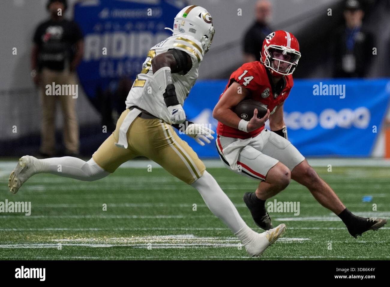 Georgia quarterback Gunner Stockton (14) runs against Georgia Tech ...