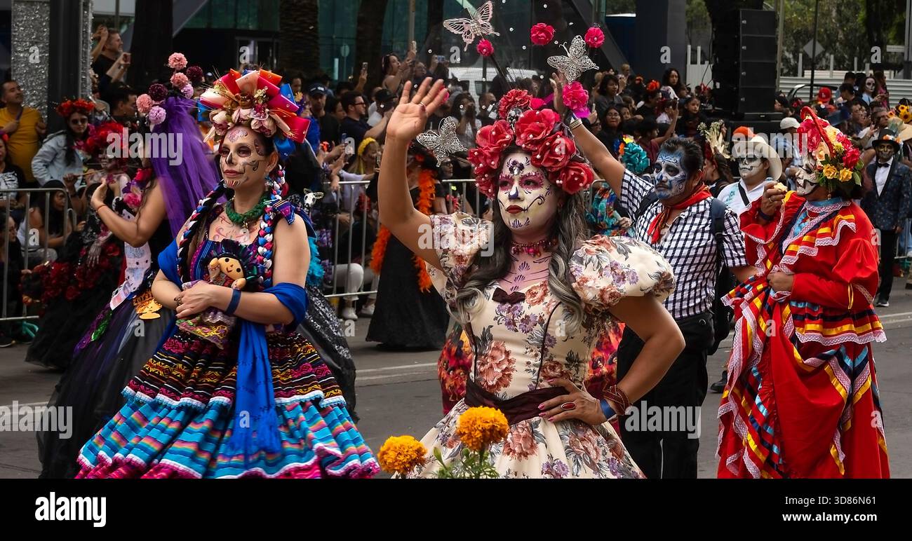 People in costumes parade participate in Day of the Dead parade in Mexico City, Mexico Stock Photo