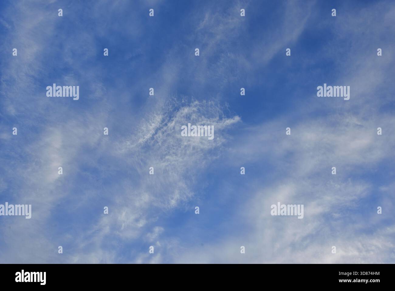 Clear blue sky with a few clouds Stock Photo