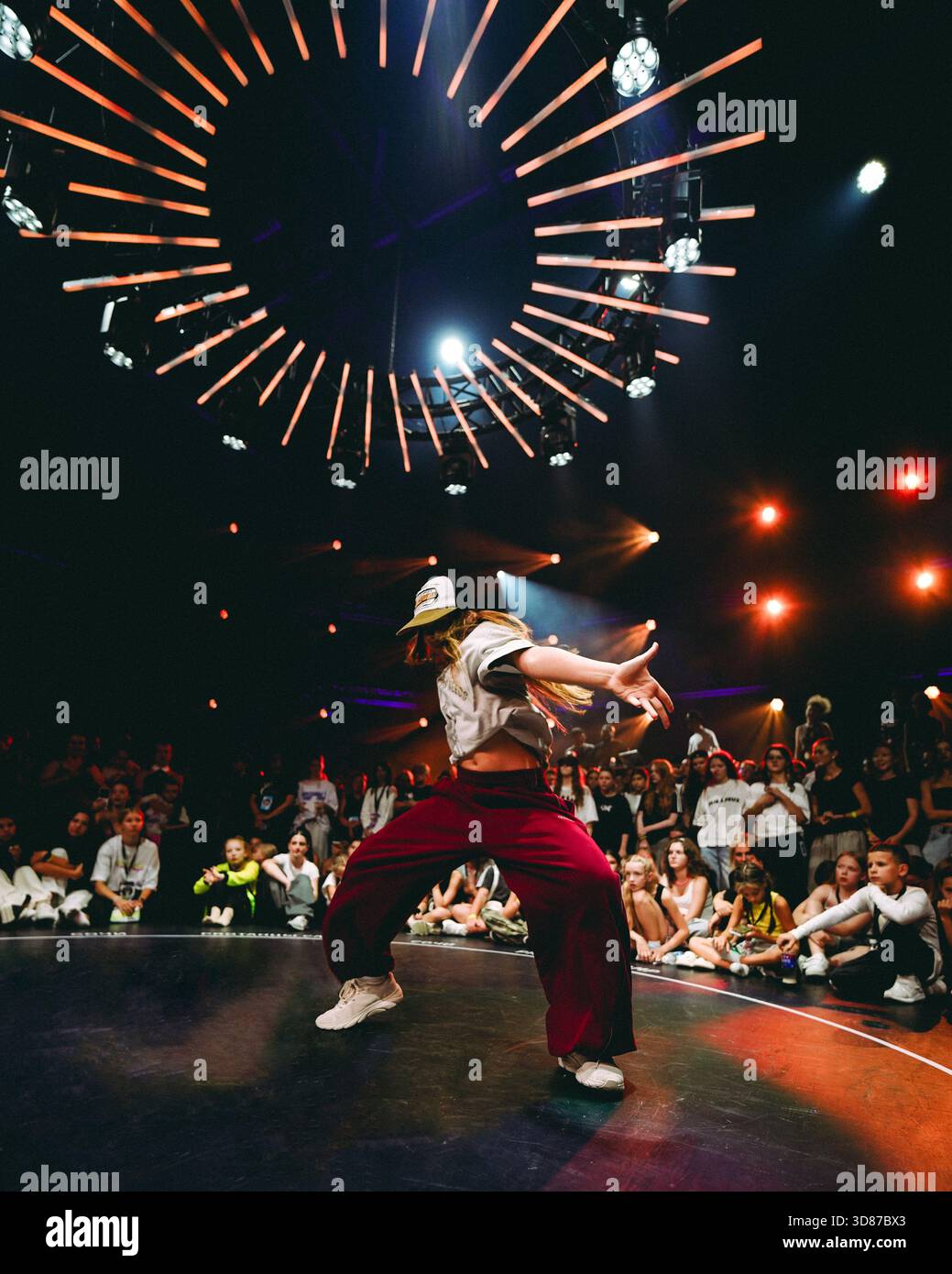 energetic breakdance showing impressive moves, vibrant street dance under colorful and dramatic lighting, highenergy urban dance battle filled with Stock Photo