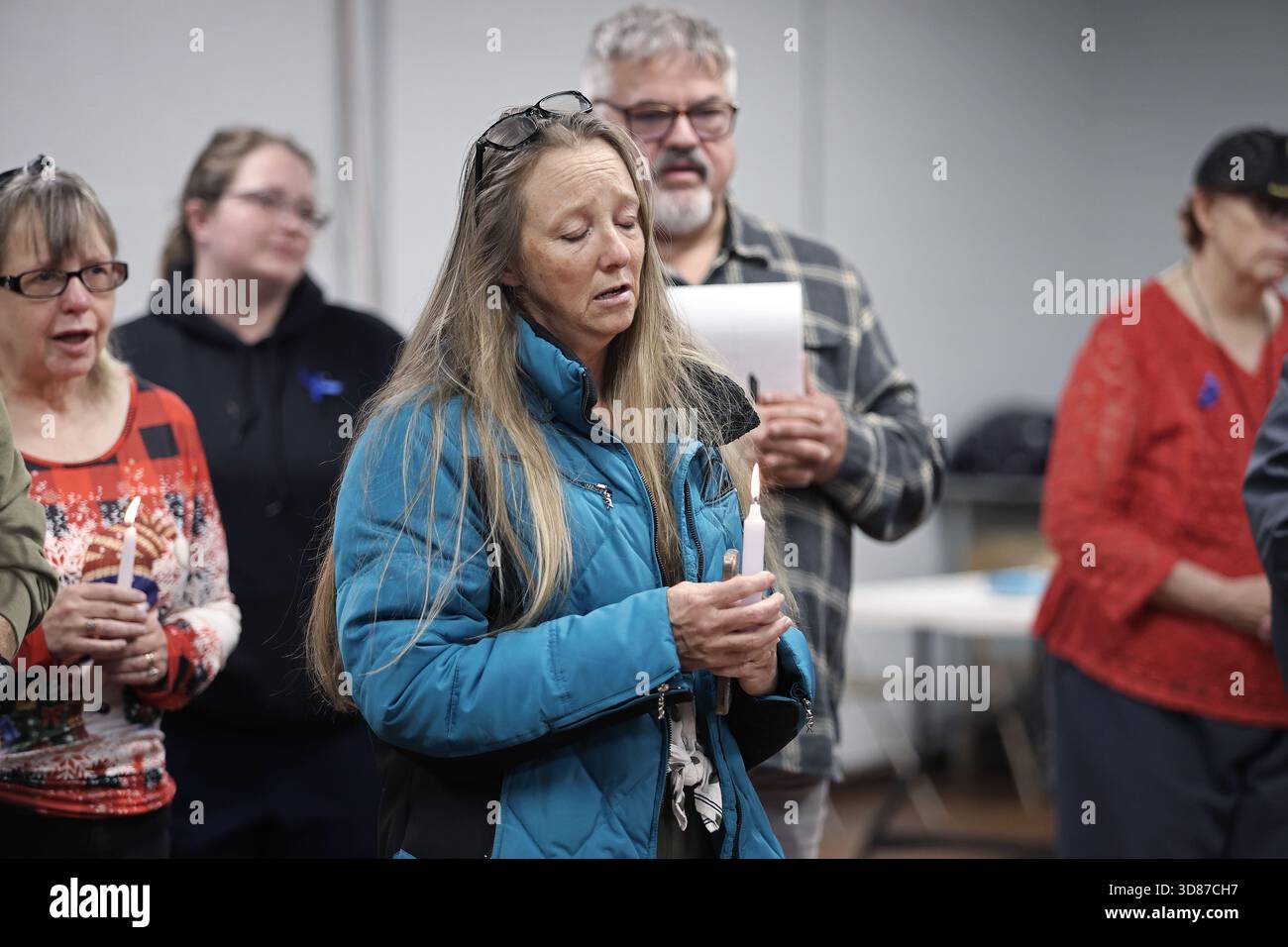 People gather for a vigil in honor of National Guard member Specialist ...