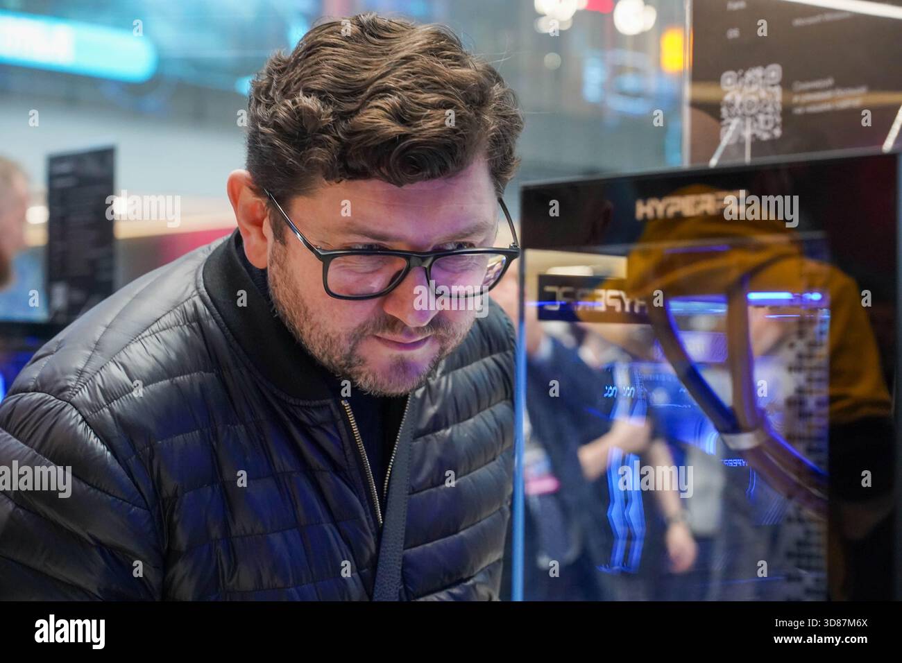A visitor to the Moscow International Video Game Week inspects a ...