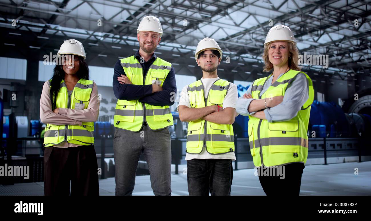 Engineer Supervising Diverse Workers At Gas Power Plant Turbines. Stock Photo