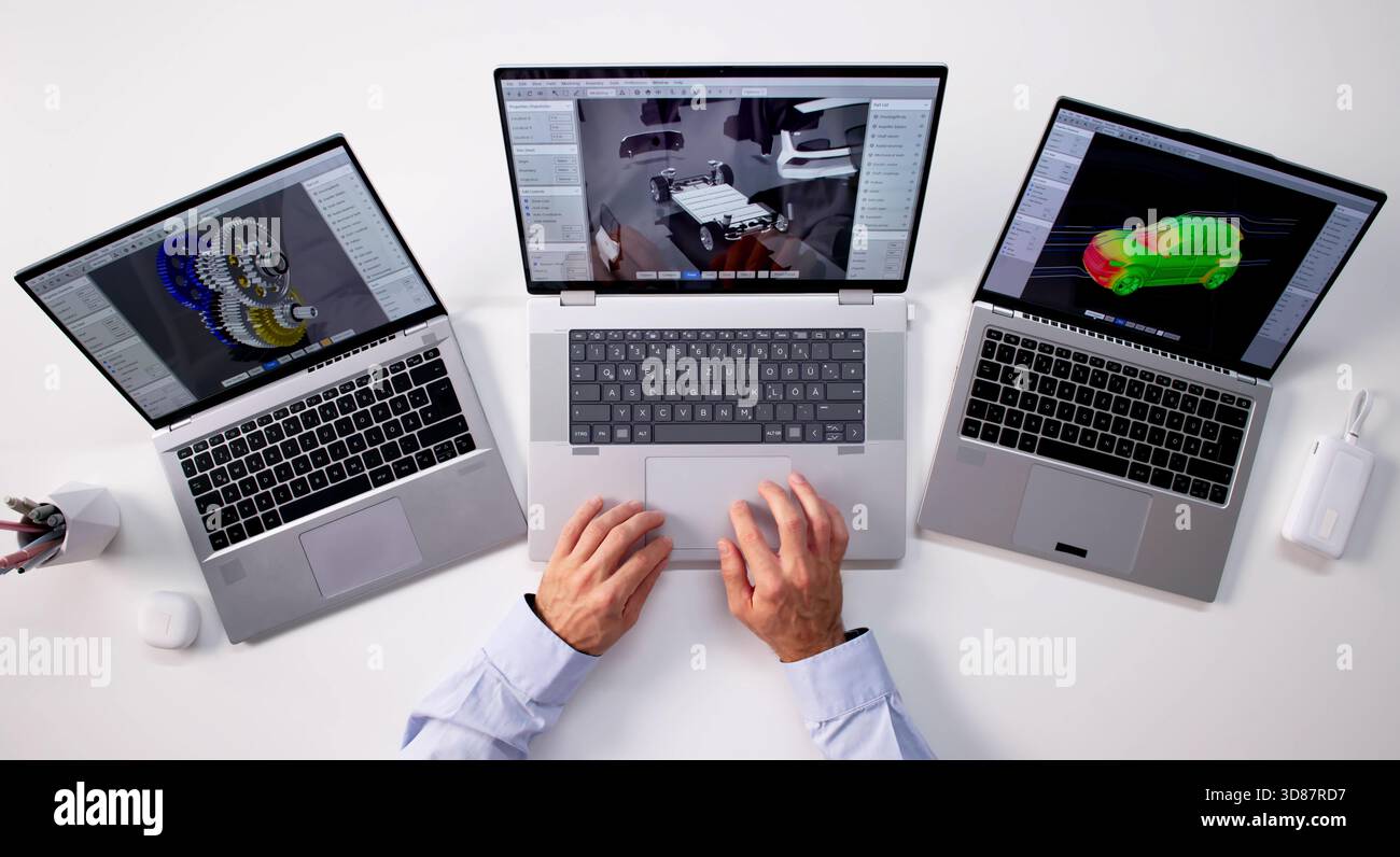 Top Digital Designer Developing Battery Pack Simulation On Personal Laptop. Stock Photo