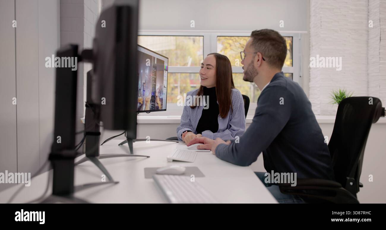 Female Graphic Designers Working On Computer For Print And Web Projects. Stock Photo