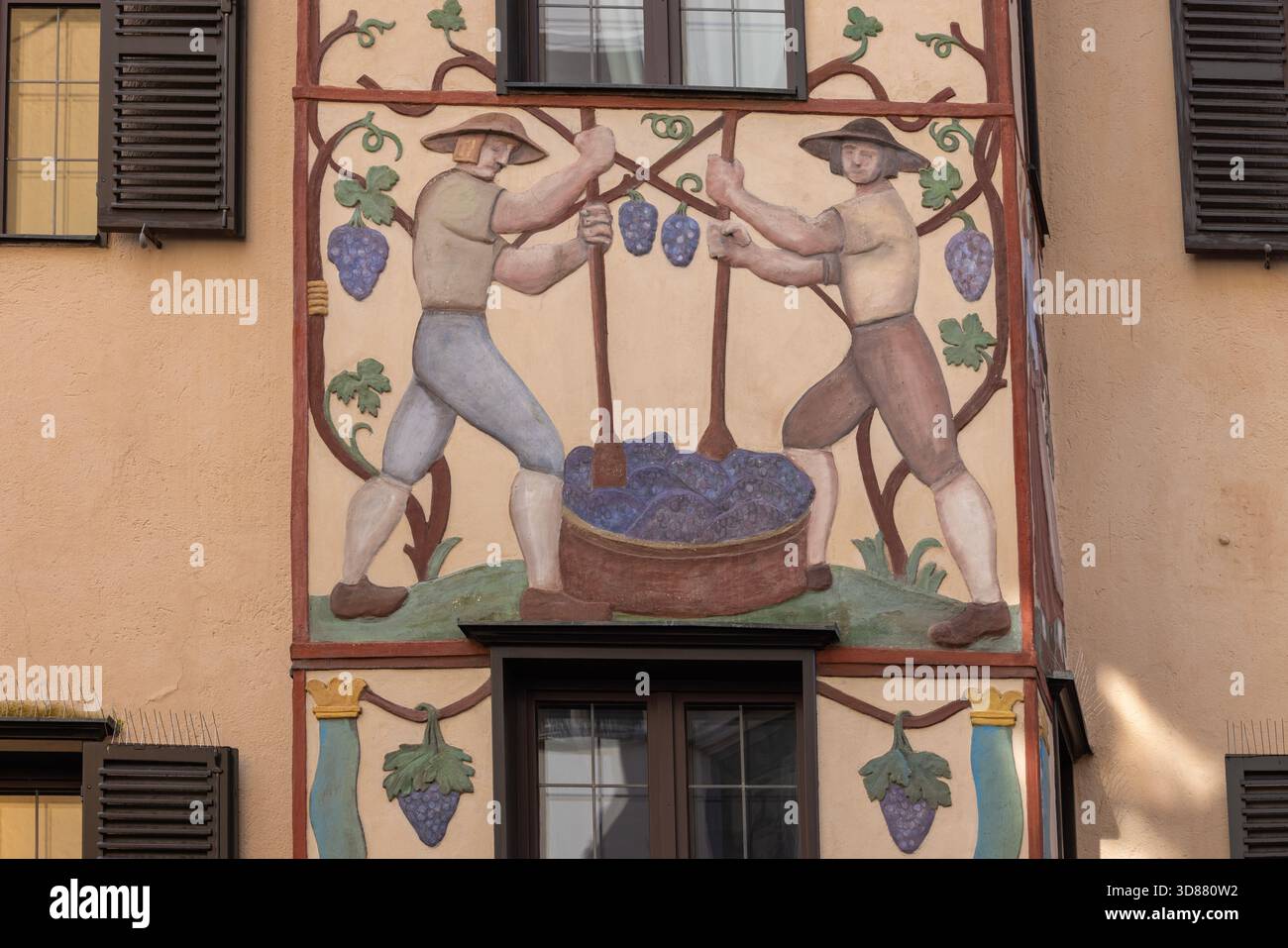 Innsbruck, Tyrol, Austria - February 26, 2023: Decorative facade 15th century hotel Hotel Weisses Kreuz, located on Herzog Friedrich street. Stock Photo