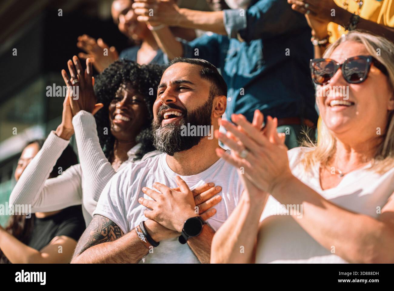 Man surrounded clapping hands hi-res stock photography and images - Alamy