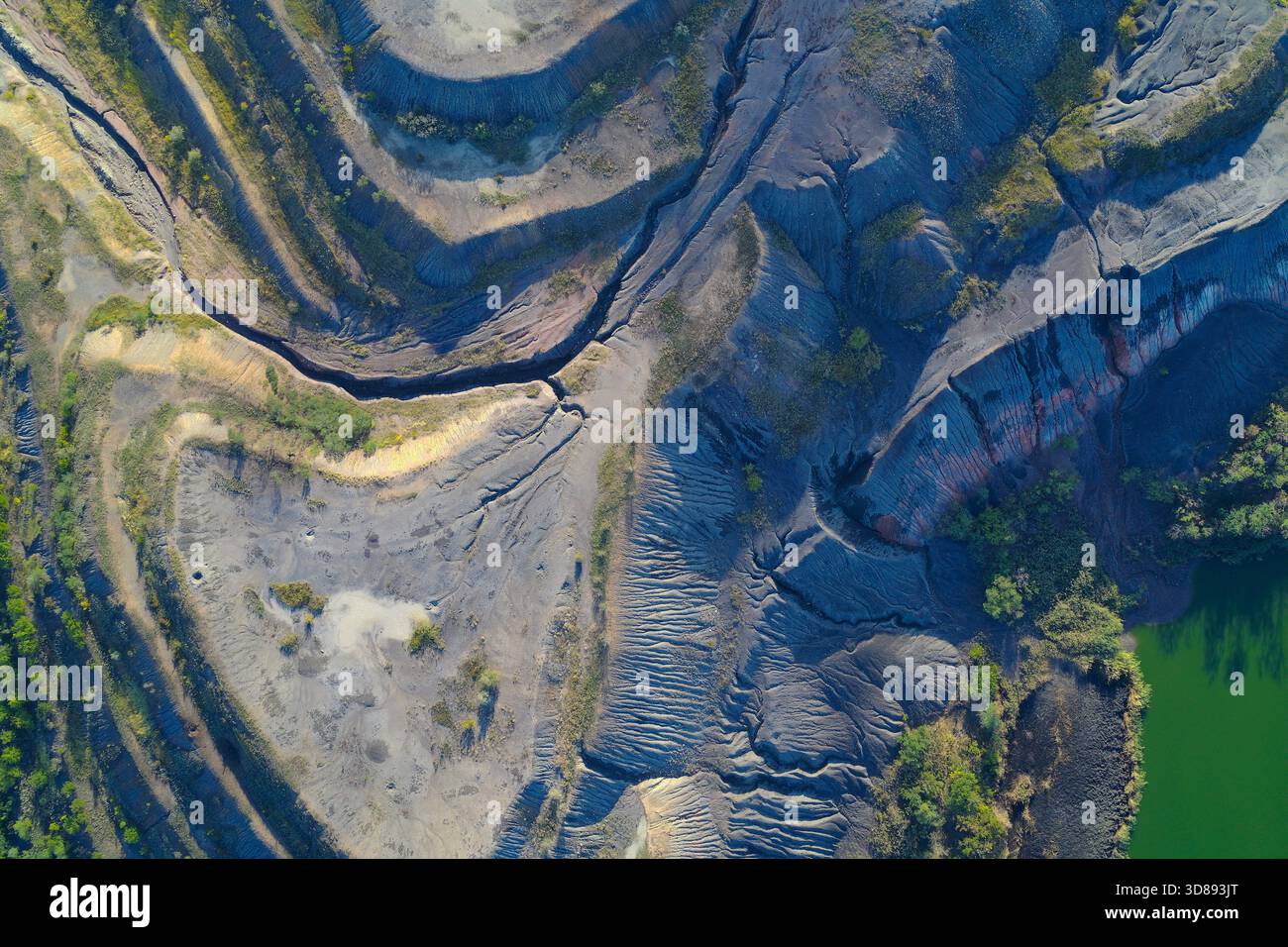 Top-down drone shot showing deep ravines cut through geological ...