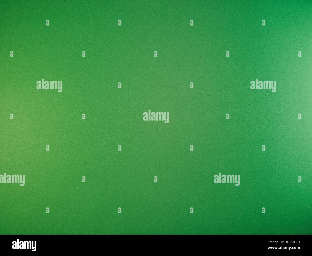 Vibrant Green Paper Texture Background - Vibrant green, finely textured paper surface provides an excellent backdrop for creative projects, presentati Stock Photo