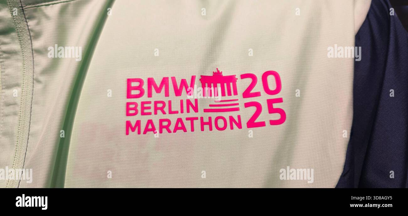 Berlin, Germany - September 19, 2025: Logo of BMW Berlin Marathon 2025 displayed on athletic jacket for marketing purposes. - Smartphone Captured Stock Image