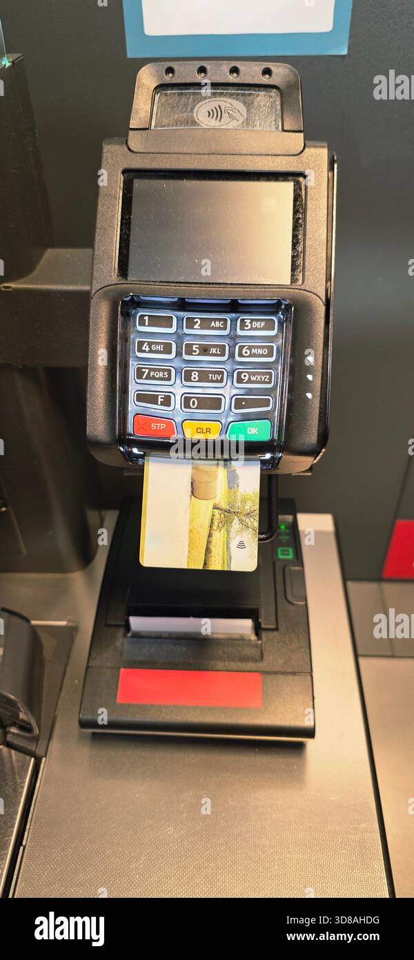 Berlin, Germany - September 27, 2025: Payment terminal features card reader and keypad for secure contactless transactions. - Smartphone Captured Stock Image