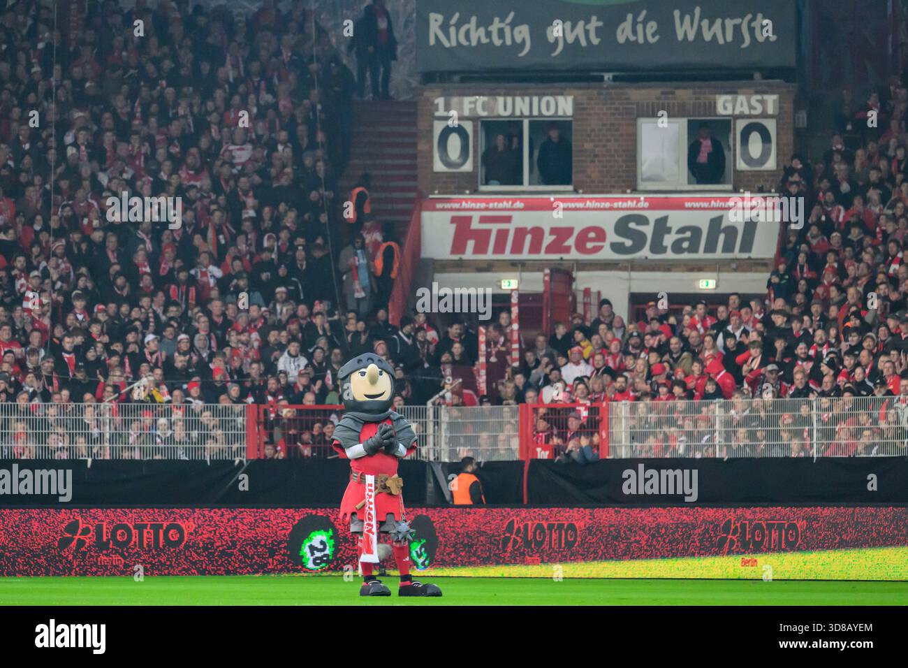 in the picture from left to right: Fans [supporters], Scoreboard ...