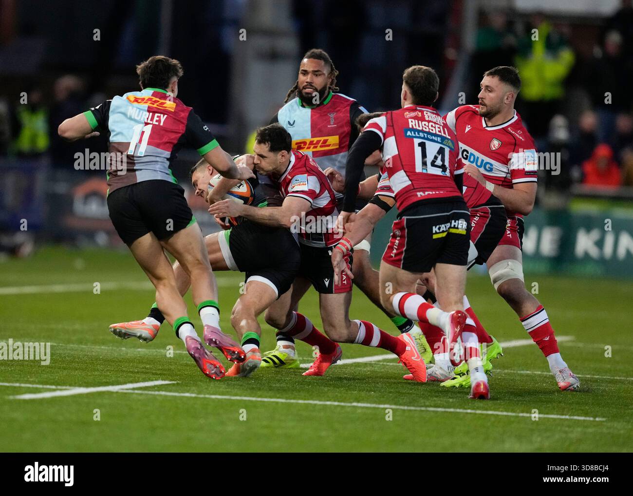 Gloucester,UK, 29 Nov 2025 Cameron Anderson #15 of Harlequins is held ...