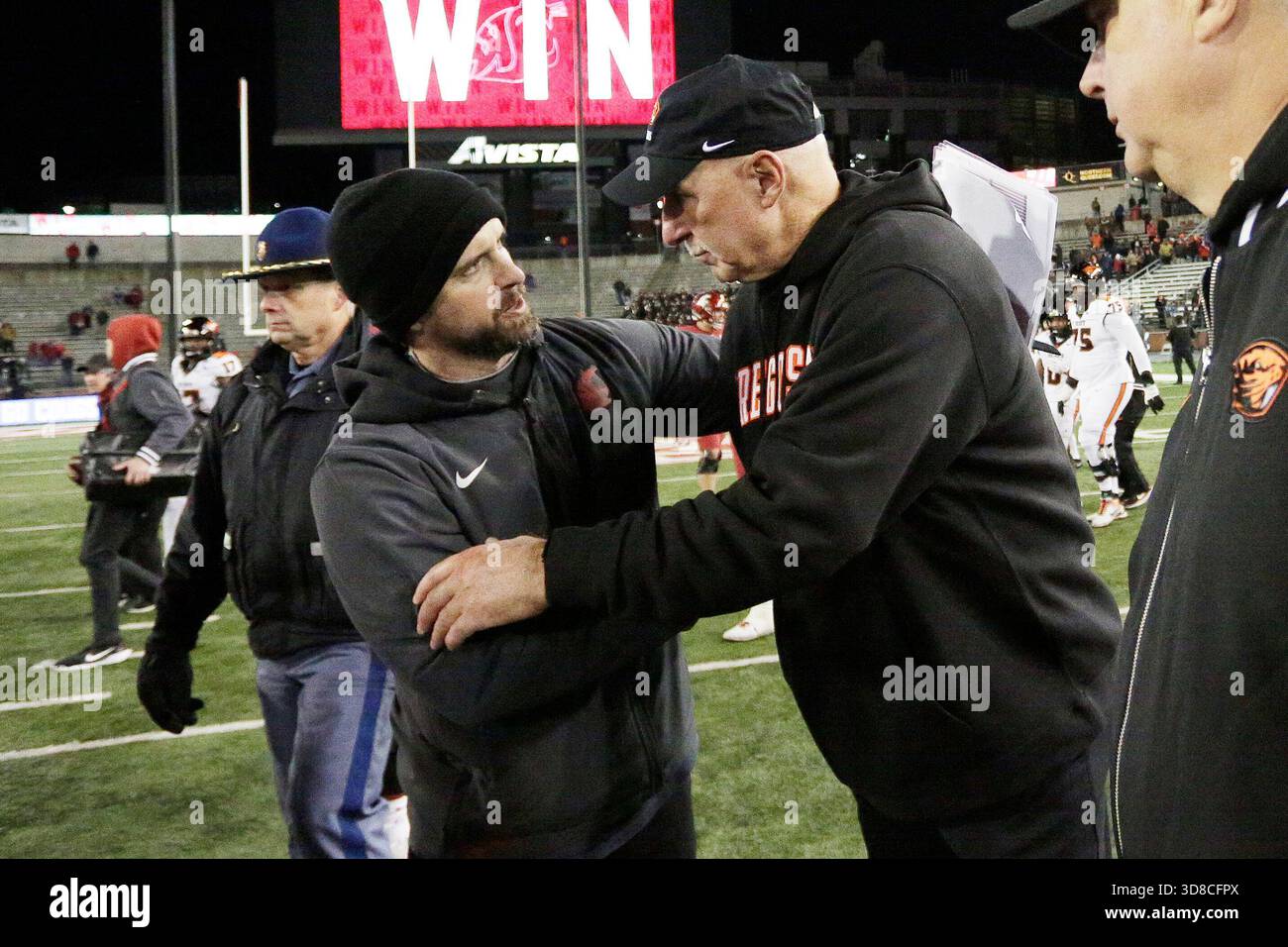 Washington State head coach Jimmy Rogers, left, and Oregon State ...