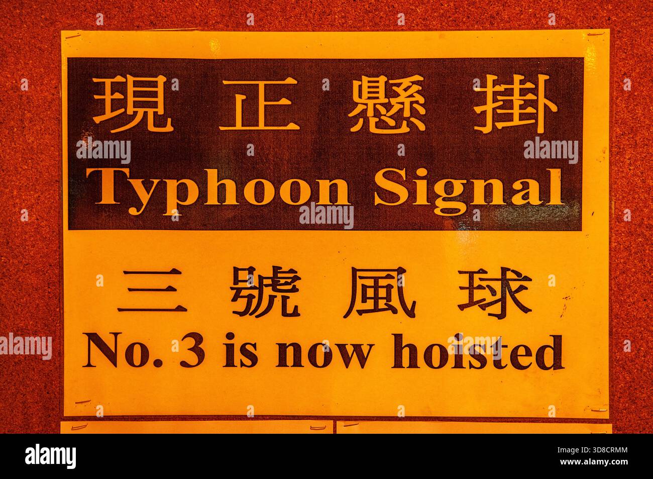 bilingual typhoon warning sign at a ferry terminal. Hong Kong, China. © Kraig Lieb Stock Photo