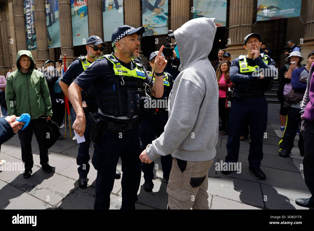 Police Rhetoric Victoria Police officers conduct searches to a counter protester during ...