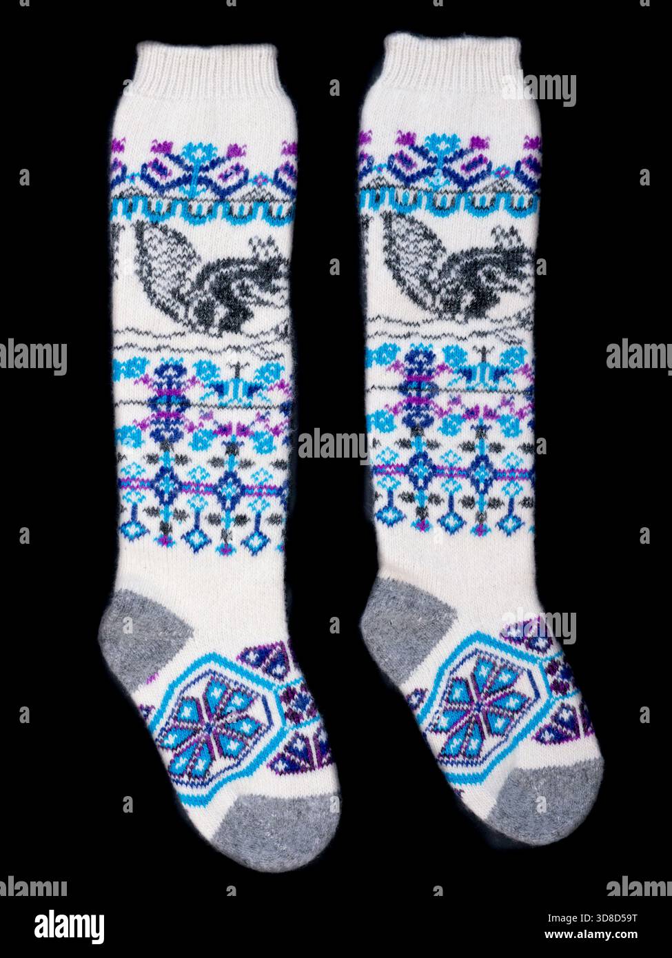 Multicolored socks on a black background. Stock Photo