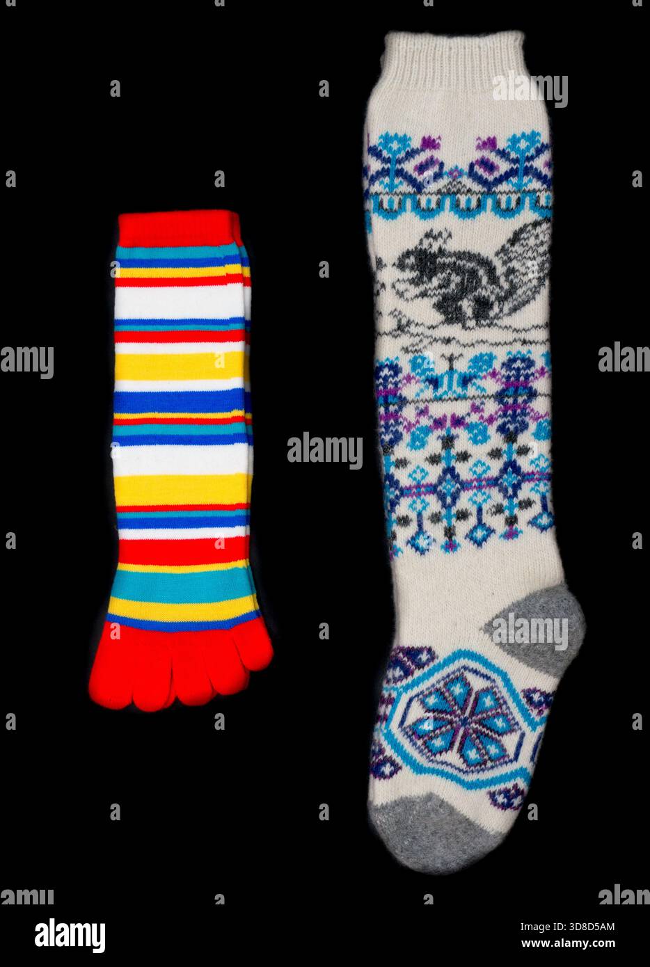 Multicolored socks on a black background. Stock Photo