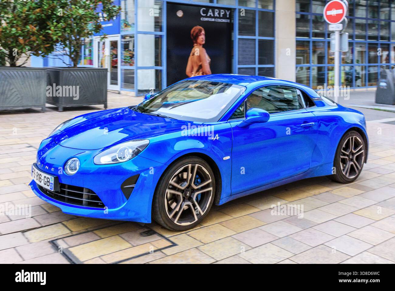 French Renault Alpine A110 sports car driving through city - Tours, Indre-et-Loire (37), France. Stock Photo