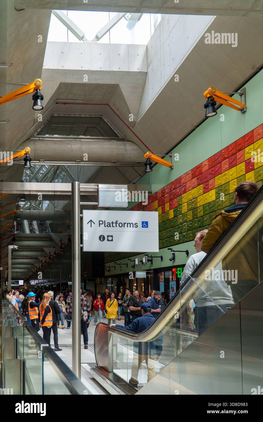 Melbourne, VIC, Australia. November 30, 2025. - Crowds of people navigate escalators and concourses inside Parkville Station, celebrating the Metro Tu Stock Photo