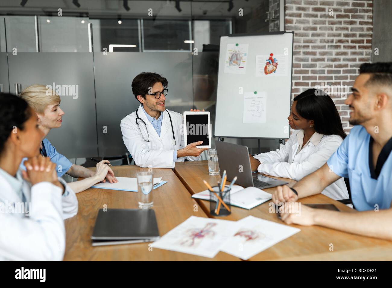 Chief physician holding digital tablet with blank screen Stock Photo