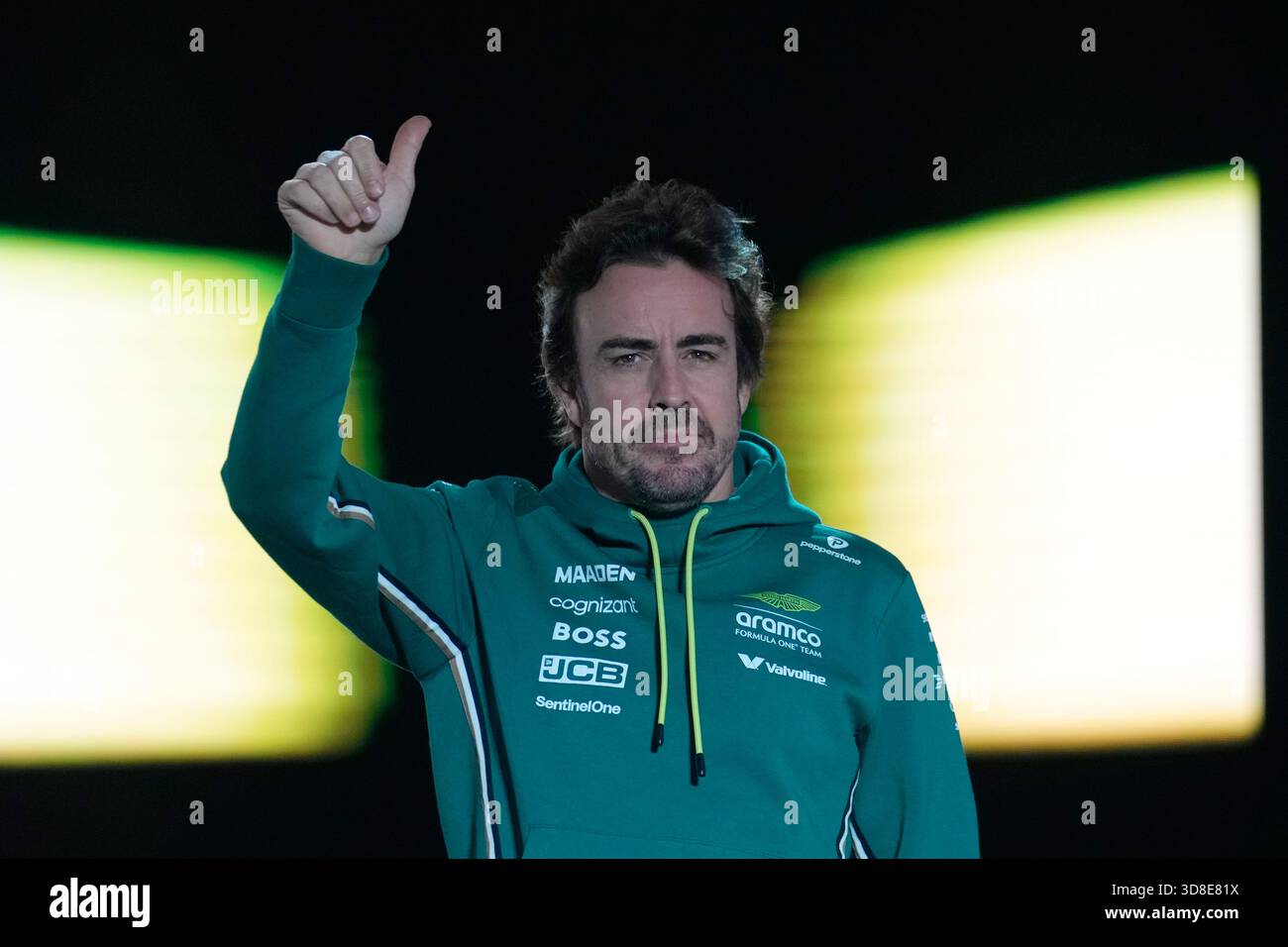 Aston Martin driver Fernando Alonso of Spain reacts as he arrives for ...