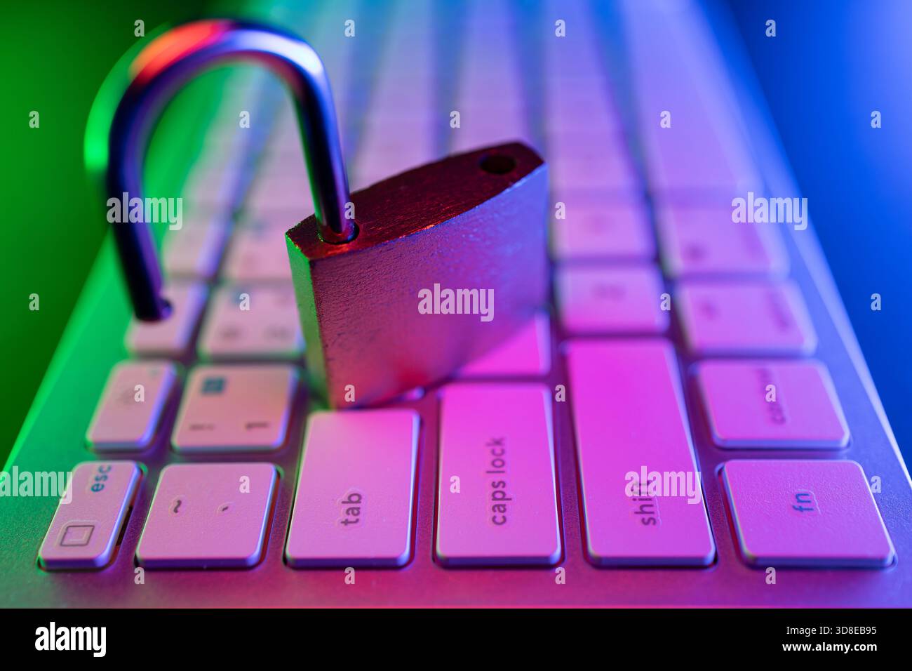 A padlock rests on a computer keyboard, symbolizing internet security and cyber protection. Stock Photo