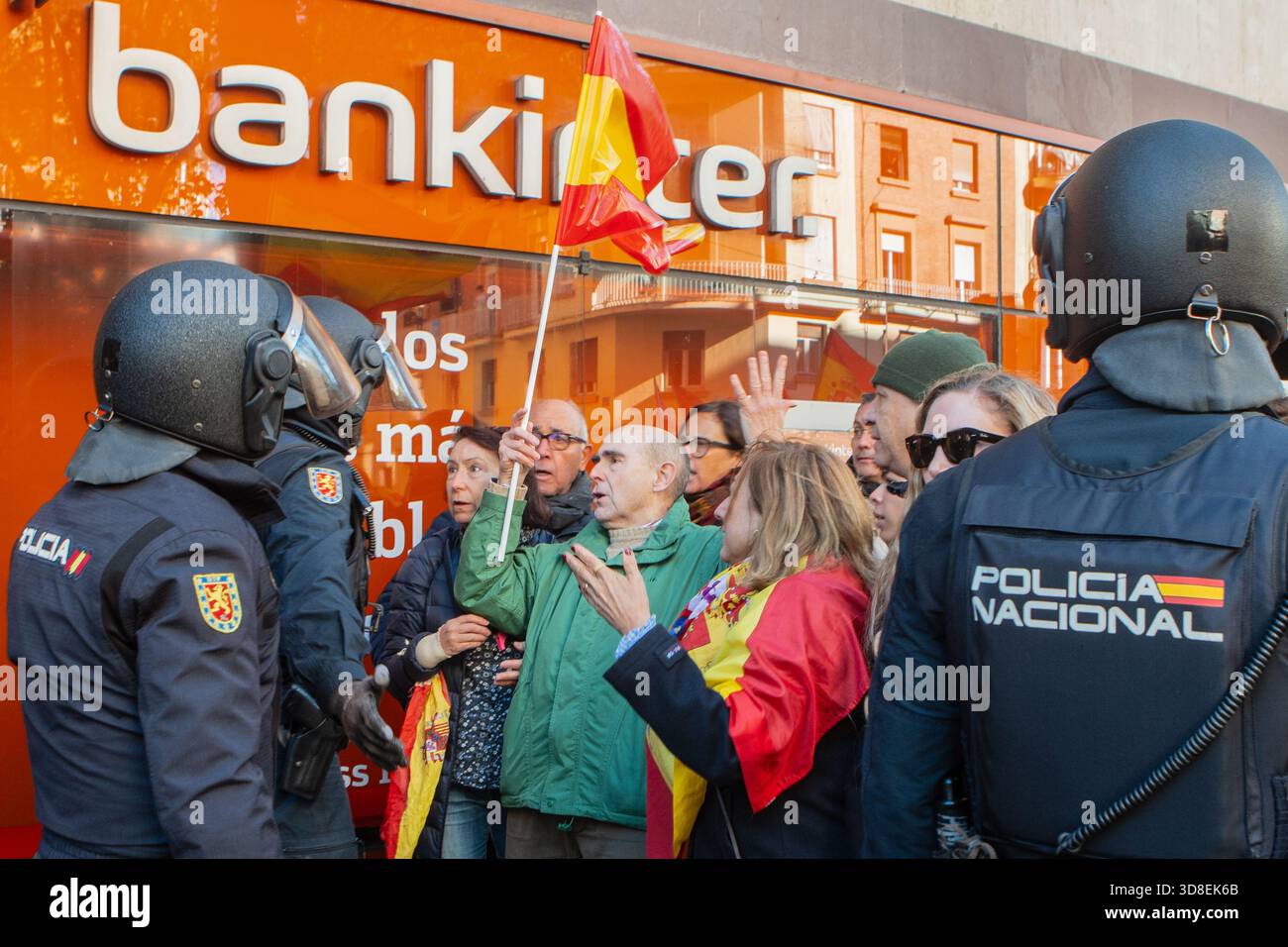 Madrid, Spain. 30 Nov 2025. Far-right protesters gather outside the ...