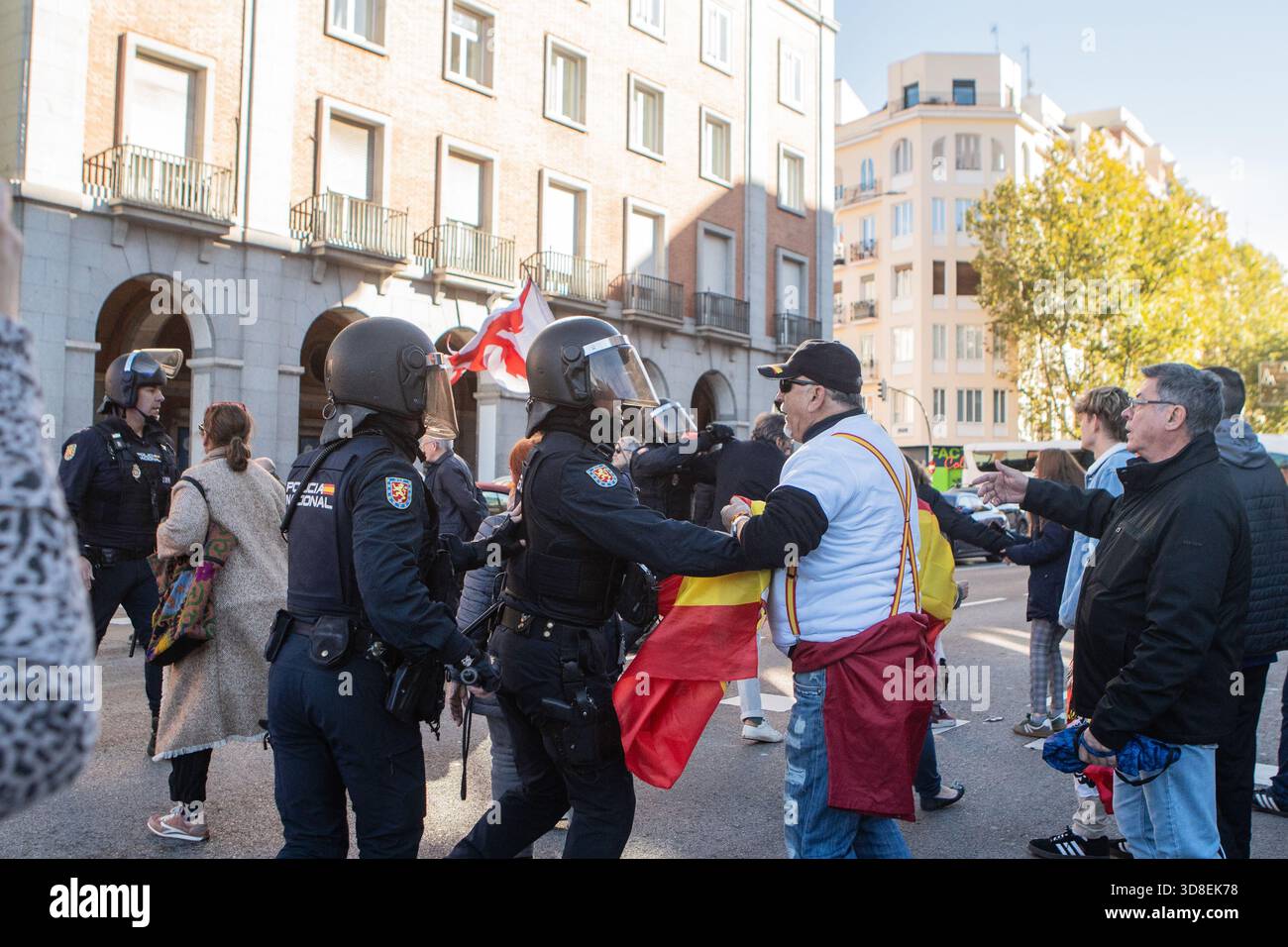 Madrid, Spain. 30 Nov 2025. Far-right protesters gather outside the ...