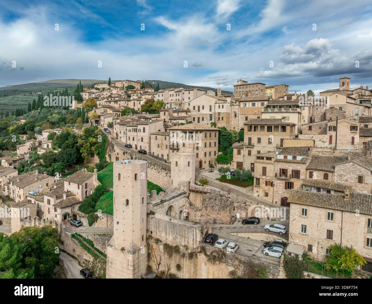 Aerial view of Spello enclosed in a circuit of medieval walls built on ...