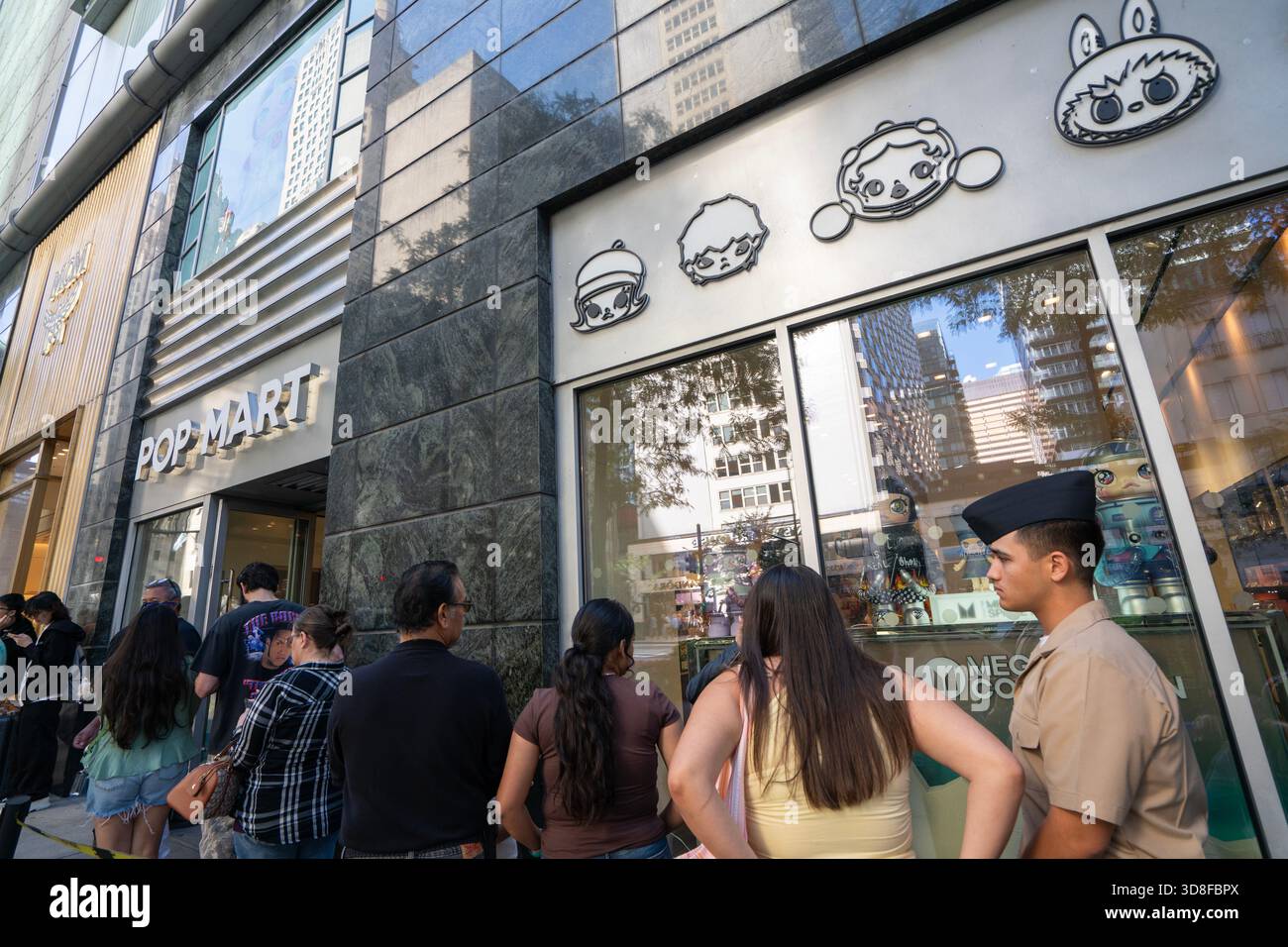 Shoppers wait in line to enter a POP MART store in Chicago, Illinois ...