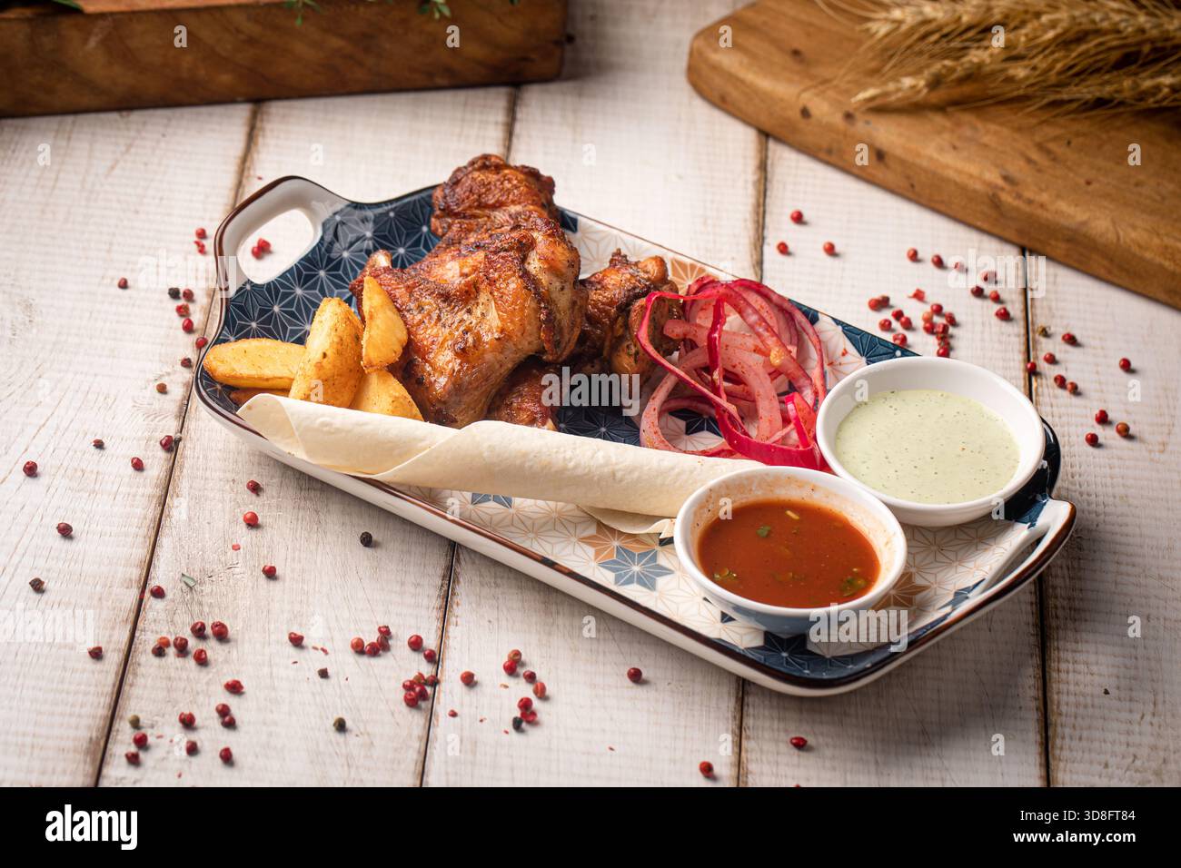 Grilled chicken wings with sauces plate Stock Photo