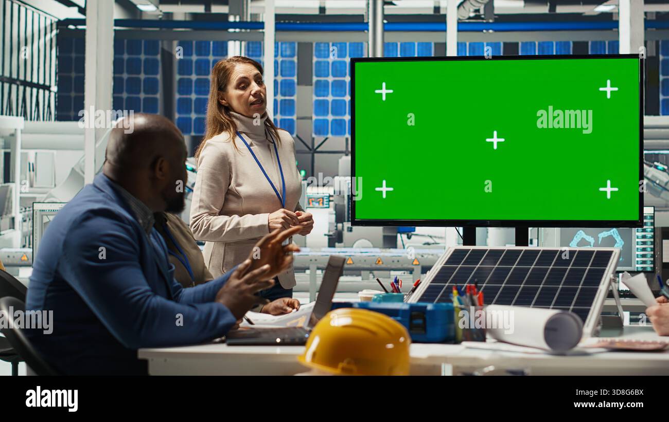G Engineering Screen Factory engineers look over assembly lines schematics during business ...