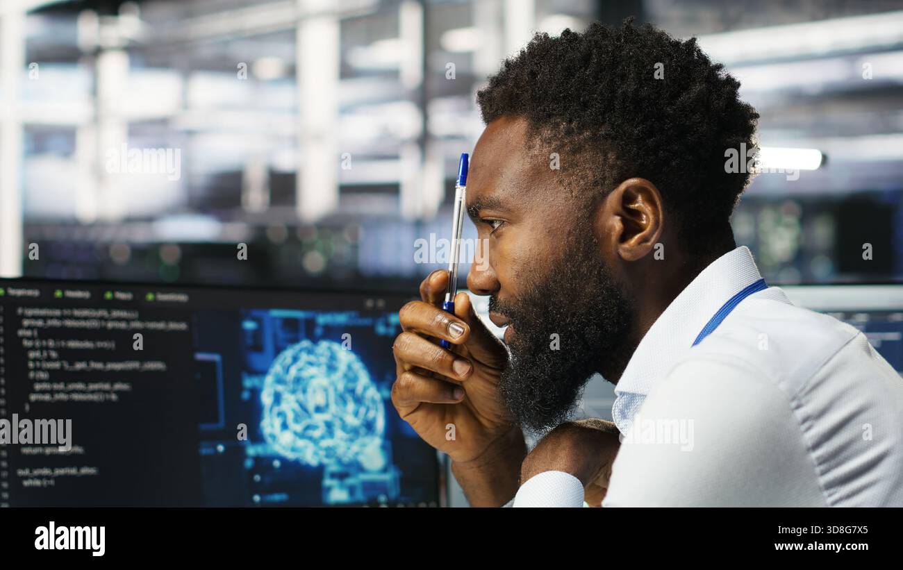 Data center programmer uses neural networks node tree program to identify equipment issues. Server hub employee reviewing AI deep learning data analysis graph to minimize failures, camera B Stock Photo
