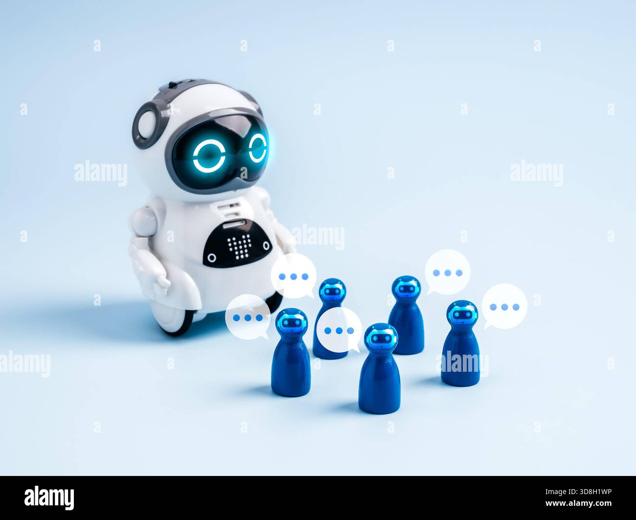 Cute AI robot interacting with chatbot avatars and speech bubbles, symbolizing AI agents, virtual assistants, robotics, and future innovation in artif Stock Photo