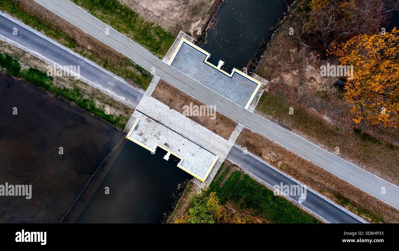 Aerial View Of Water Canal Intersection With Road And Pathways For ...