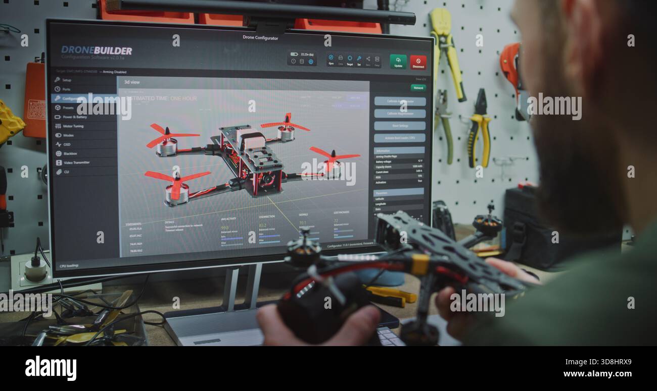 Setup Programming Firmware and Analyzing Drone Telemetry Data. Specialist Deeply Engaged in Programming Drone Firmware and Analyzing Telemetry Data on Desktop Computer. Complex Flight Simulation. Stock Photo