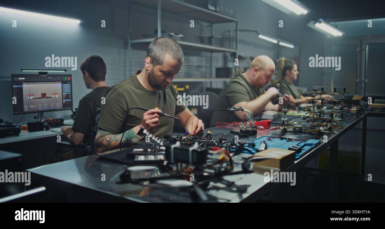 Drone Engineering on Factory. Full Drone Engineering Process, From 3D Design on Computer Hands on Soldering and Assembly. Concept of Integrated Workflow in Cutting Edge UAV Production Facility. Stock Photo