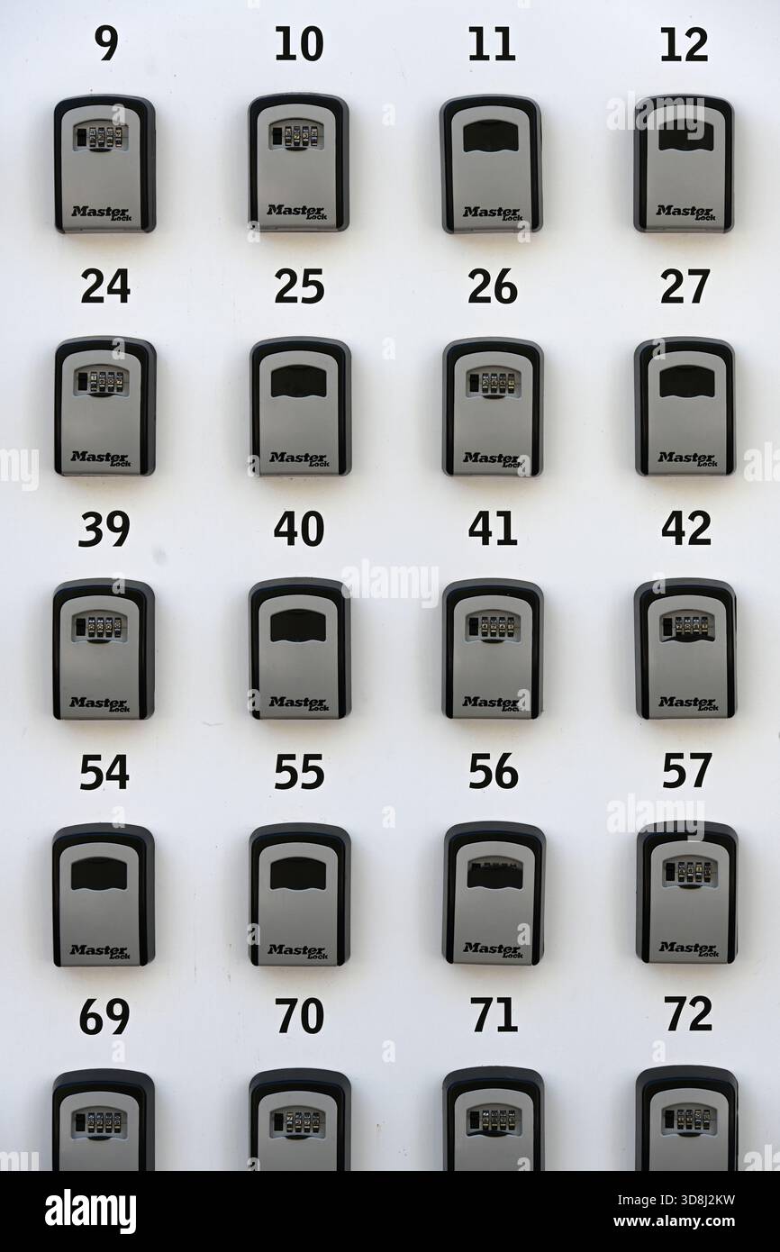 Lines or Rows of Numbered Key Boxes, Lock Boxes or Security Boxes Stock Photo
