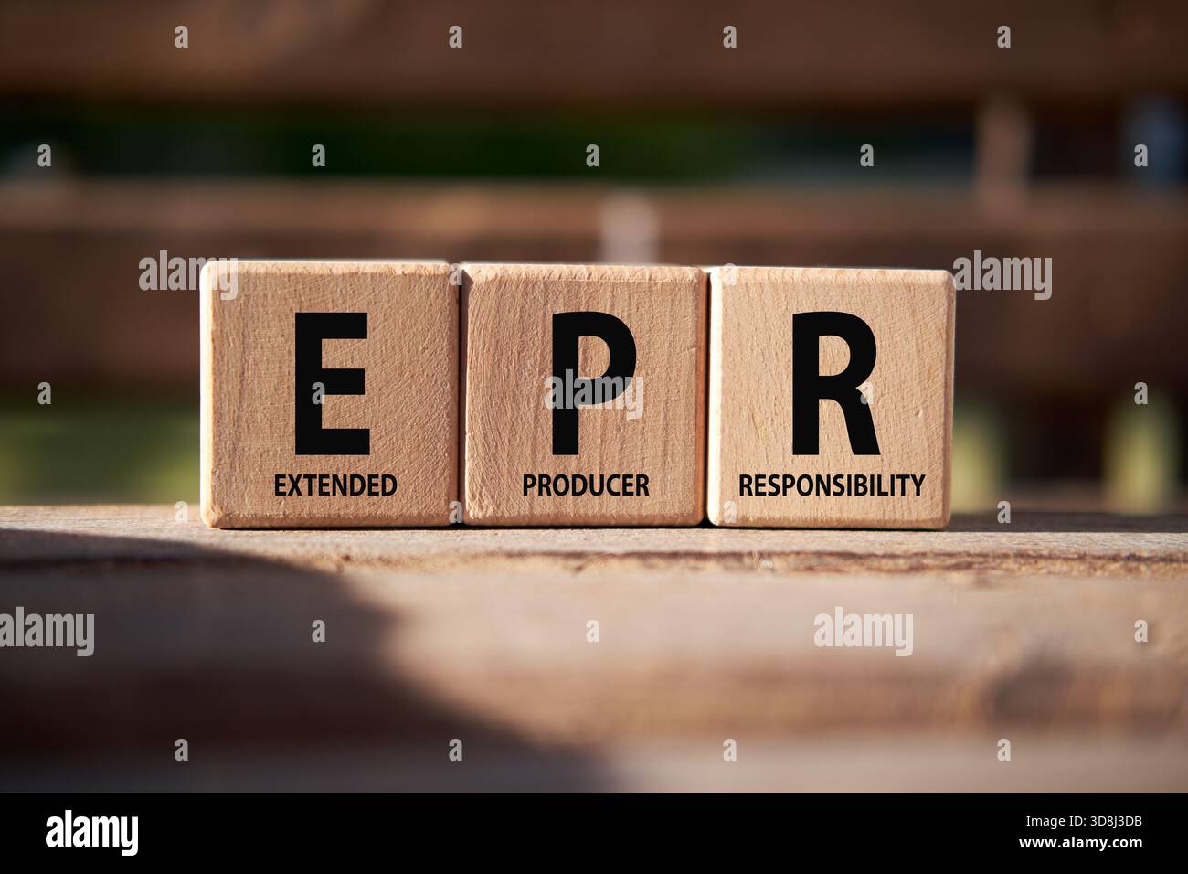 Wooden blocks spelling EPR and Extended Producer Responsibility, representing environmental sustainability and accountability Stock Photo